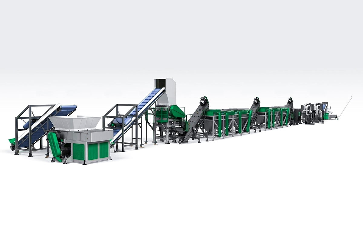 a comprehensive plastic recycling line designed for shredding and densifying PP/PE films. This setup includes various interconnected modules like conveyor belts, shredders, wash stations, and densifiers, all primarily in green and gray colors. Such systems are essential for processing plastic films, turning them from waste into reusable materials through a series of mechanical and chemical processes. The layout is organized to optimize the flow of materials from the initial shredding stages to the final densification, ensuring efficient recycling operations.