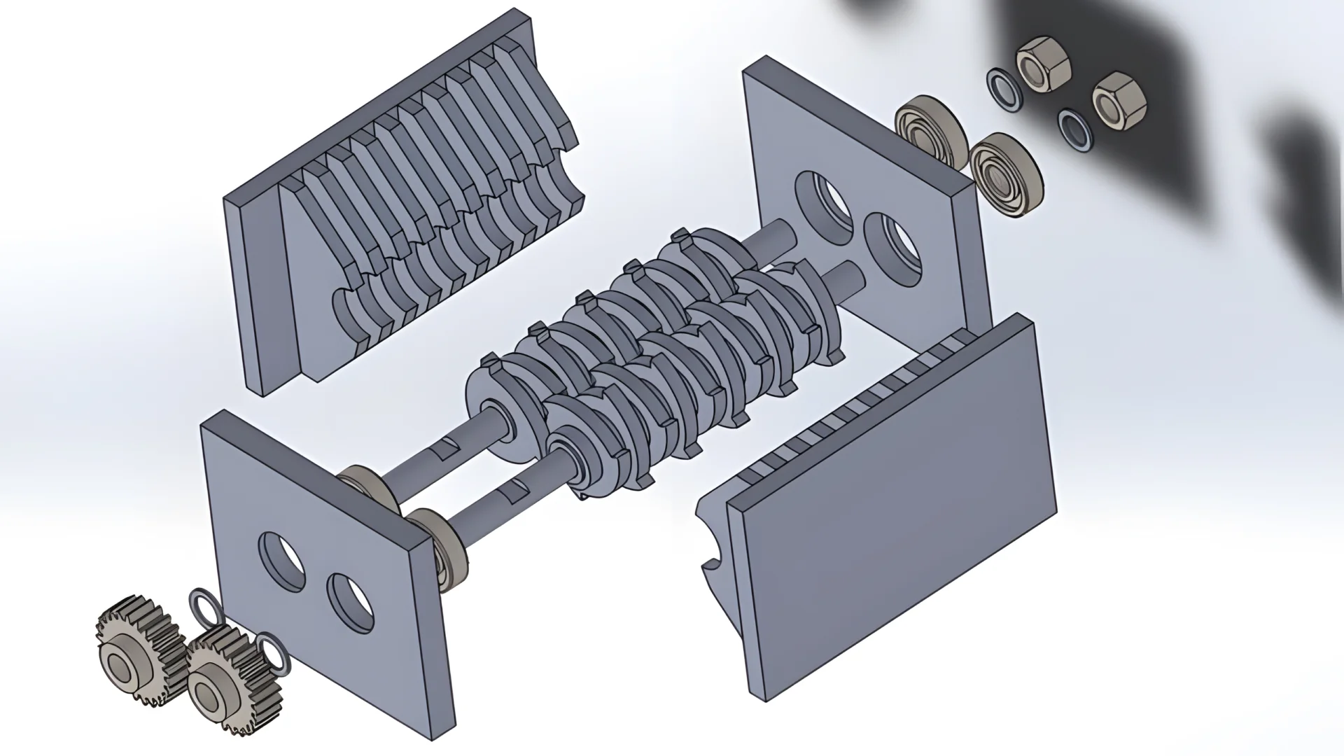 An exploded view of a shredder blade assembly, illustrating the components and their arrangement. The image shows two interlocking shafts with mounted cutting blades, side plates, bearings, gears, and fasteners. The detailed layout highlights how the blades are positioned and how they interact with each other