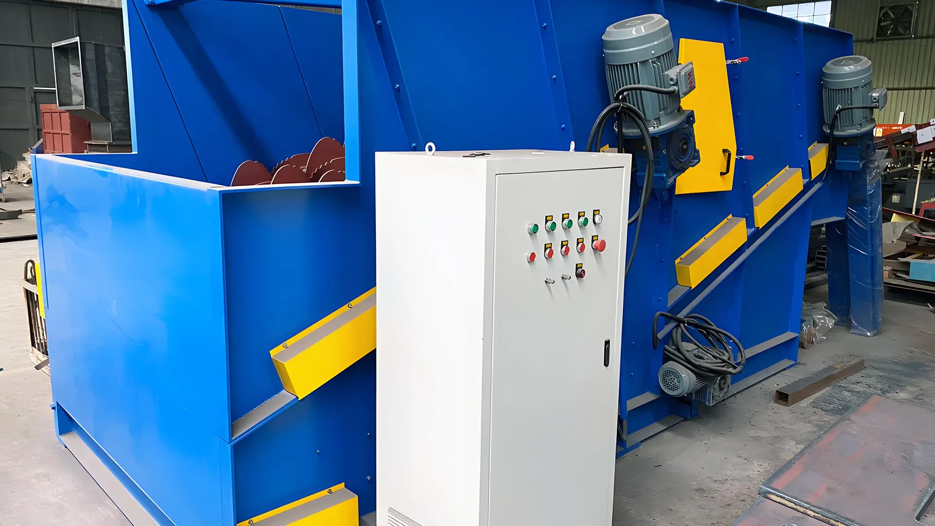 Blue and yellow disk separator machine used in plastic recycling with an attached white control panel.