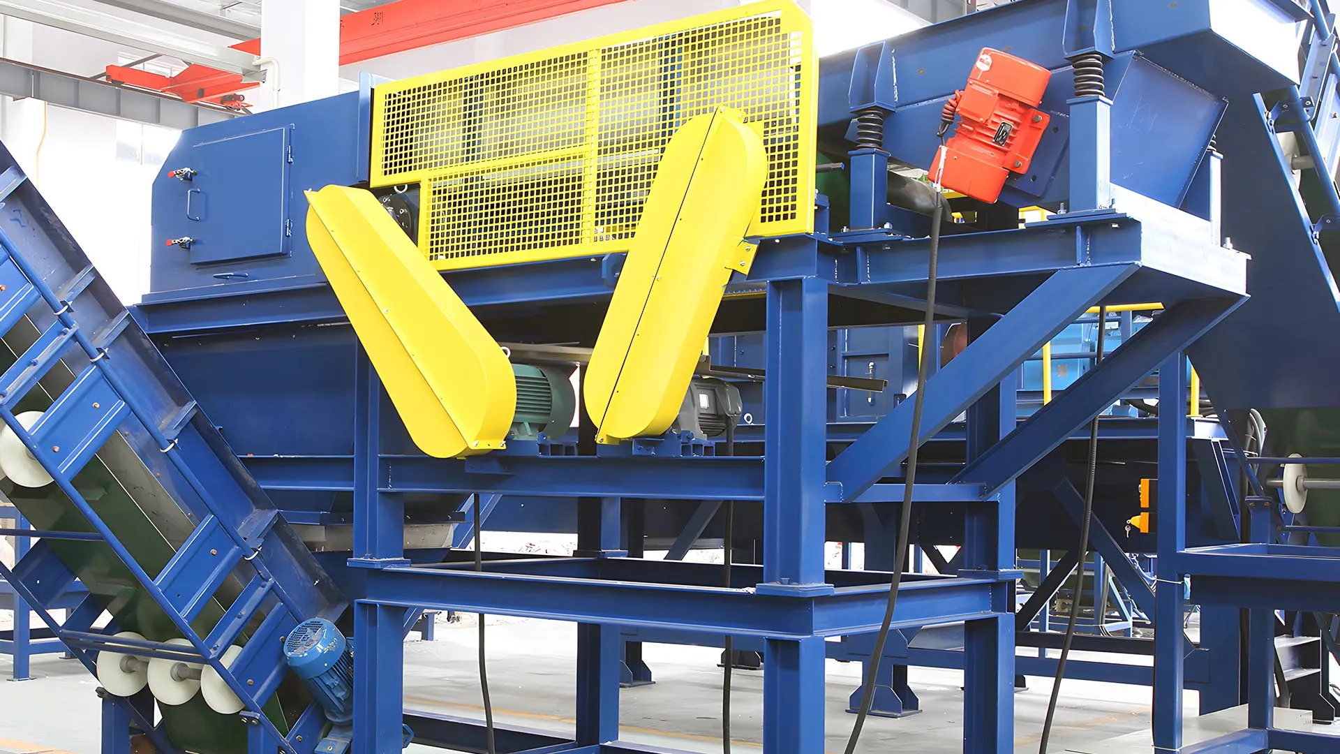 Eddy current separator for efficient non-ferrous metal recovery, featuring blue and yellow components with a modern industrial design.