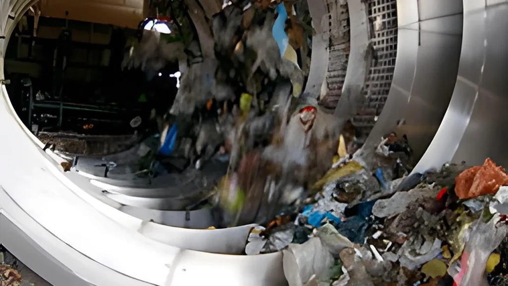 Blurred garbage inside a rotating washing machine drum.