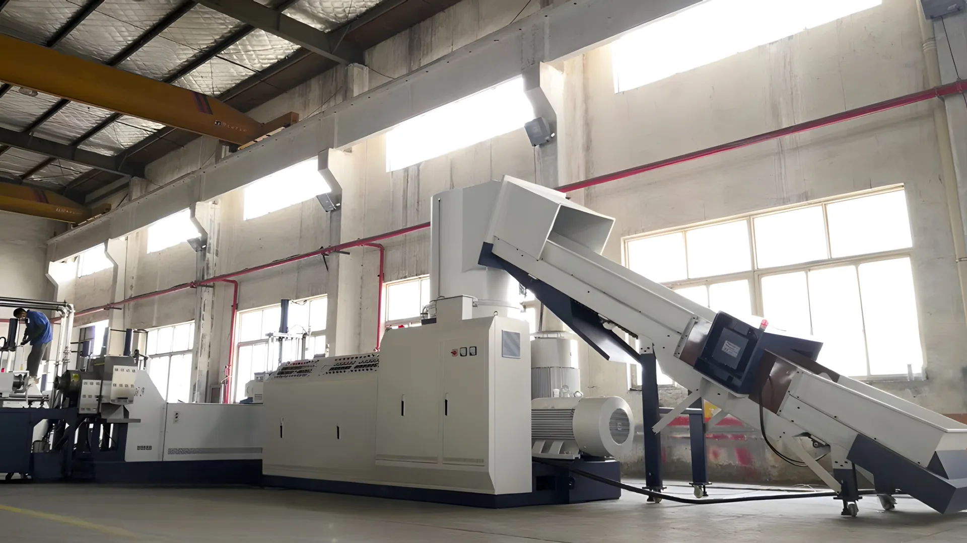 Industrial plastic recycling machine in a factory