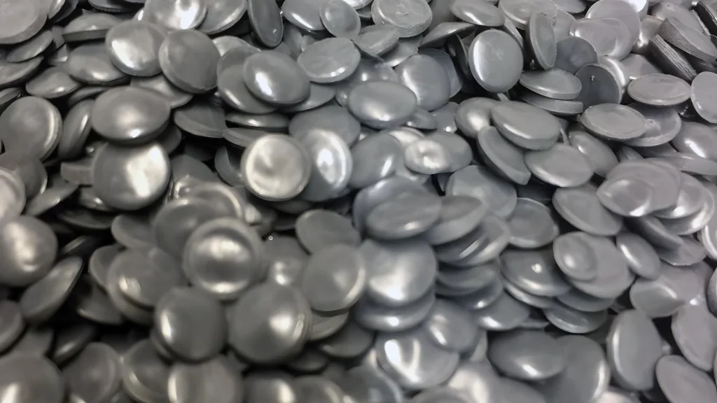 Close-up of gray industrial plastic pellets