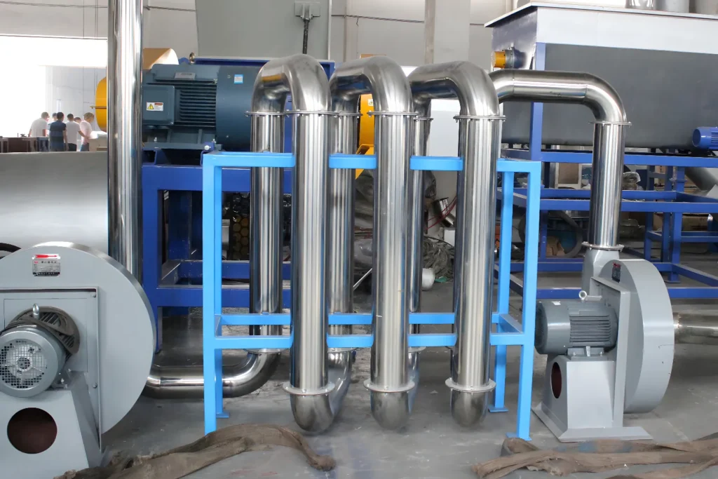 Industrial machinery with stainless steel pipes and motors