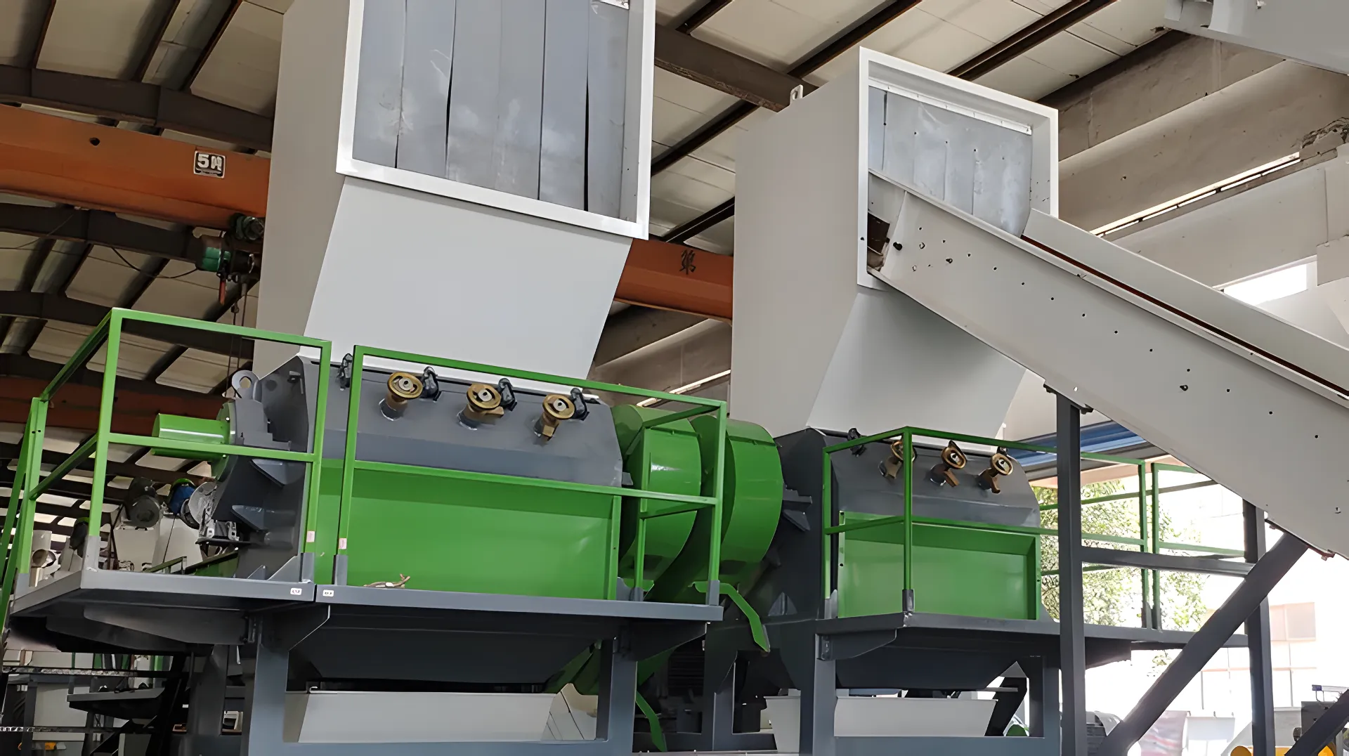 Industrial recycling machinery in a processing facility