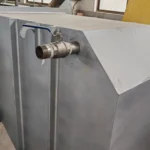 Large gray industrial tank with protruding metal faucet