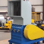 Industrial granulator machine in manufacturing plant workshop