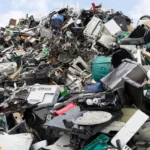 discarded electrical appliances in a scrapyard